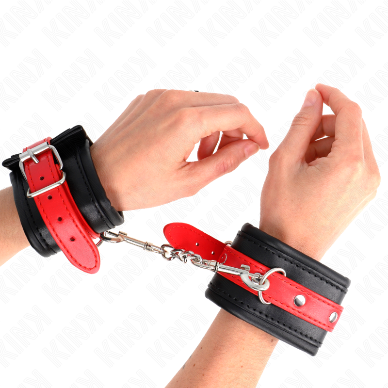 KINK - MENOTTES DE POIGNET NOIRES AVEC SANGLE ROUGE AJUSTABLE 17-28 CM X 6 CM