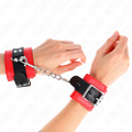 KINK - MENOTTES DE POIGNET ROUGES AVEC SANGLE NOIRE AJUSTABLES 17-28 CM X 6 CM
